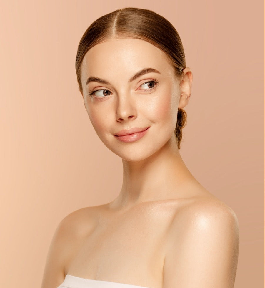 Woman with smooth skin on a beige background